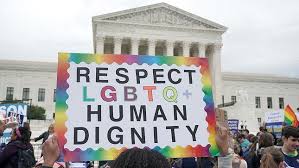 Sign in front of the Supreme Court that says Respect LGBTQ Human Dignity